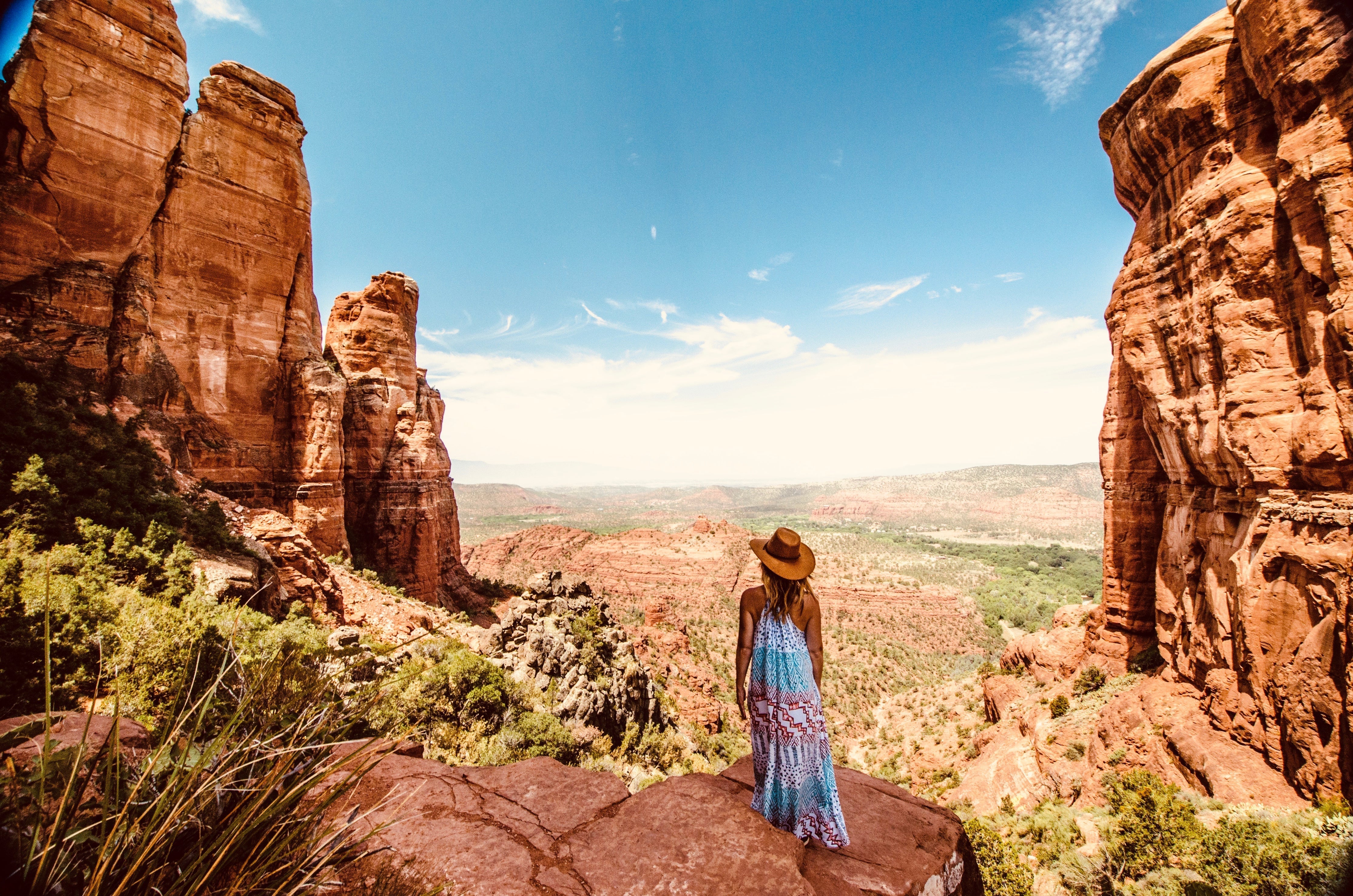 Woman wearing a dress and hat in a canyon